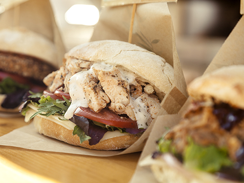 Food truck sandwiches ready for pickup at a community event>